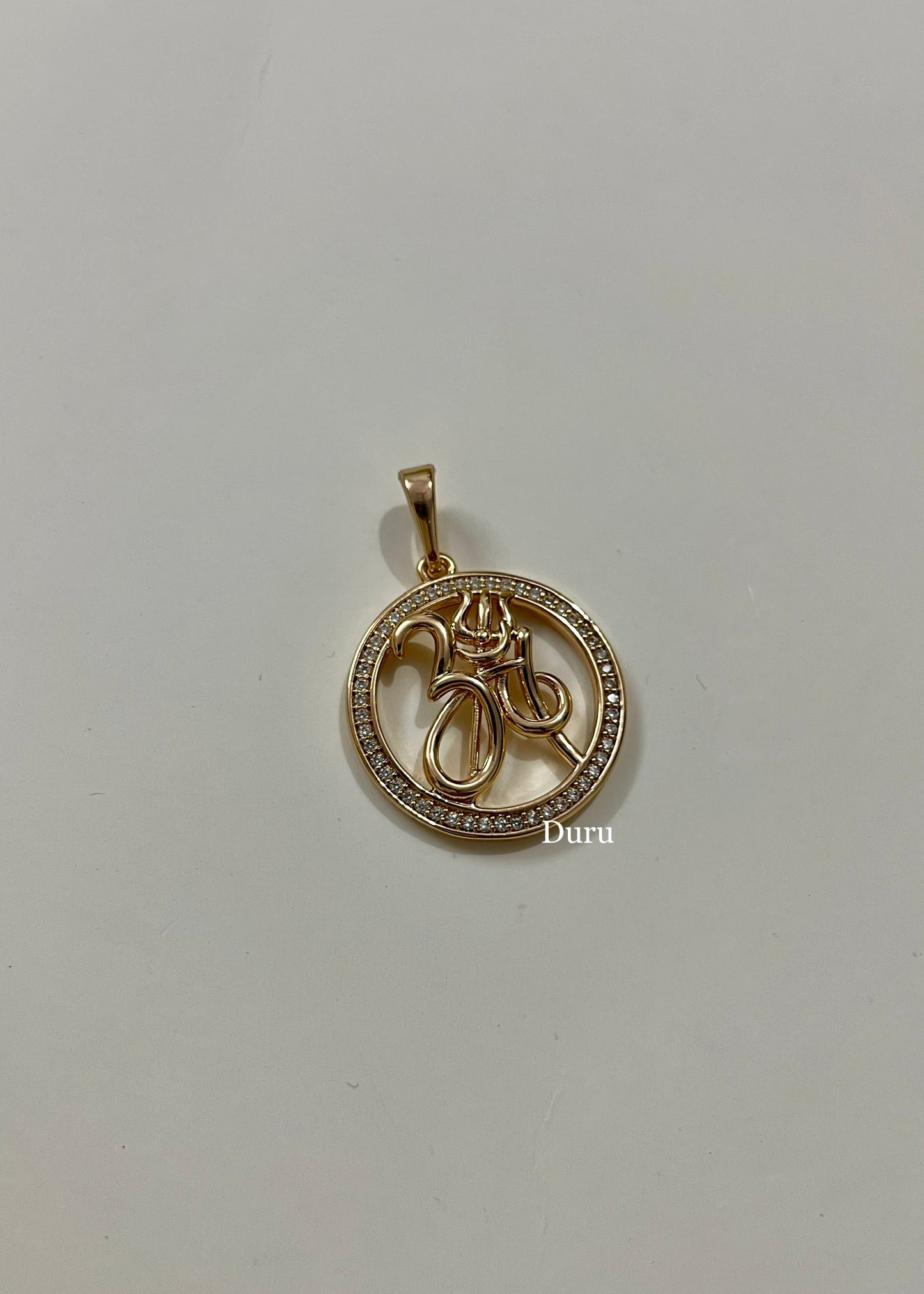Om round pendant