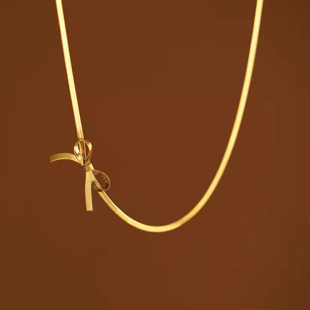 Gold bow necklace