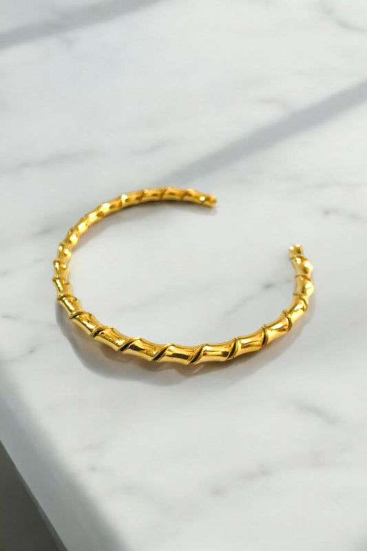 Golden swirl cuff bracelet